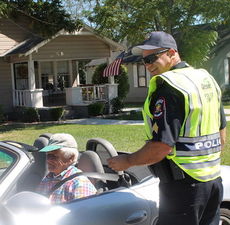 Sgt. Randle Ballenger enjoyed the camaraderie talking with drivers and their vintage automobiles.
 