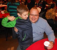 Sgt. Chad Richardson and his son, Jacob, enjoy Breakfast with Santa, two years ago.
 