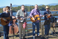 The Locust Grove Bluegrass and Joe Beam, with the gorgeous backdrop of a tranquil Lake Robinson, provided the entertainment Sunday.
 