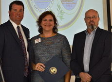 Gov. Nikki Haley sent a proclamation read by Senator-elect Scott Talley and presented to Caroline Robertson and Scott Harke of Greer Relief.