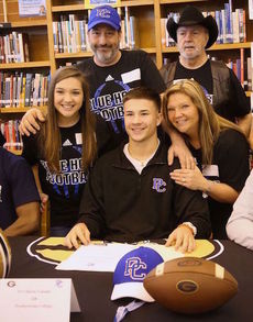 Mario Cusano signed to play football at Presbyterian College. His family attended the ceremony at Greer High School.
 