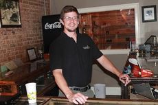 Mark Grant, operator at Cameroon Cigars, has inventory stocked for Saturday's grand opening from 6-10 p.m.
 