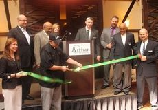 Artisans chef Billy Roberts cuts the ribbon at the ceremony opening the new restaurant at the Marriott Parkway.
 
