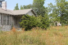 Two rotted houses and two garages must be removed before construction begins.
 