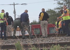 Investigators at the scene of a passing train colliding with a male in downtown Greer Thursday morning. The man, 65, was identified as David Allen Deane, know as 