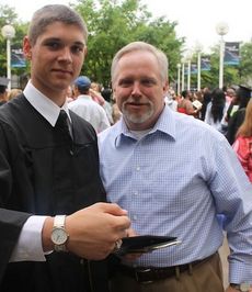 This moment in time was special for father, Bill Searcy, and son, Chandler, after Greer High School Commencement ceremonies. Chandler shows the watch his father gave him today that belonged to his grandfather, Horace, who died seven years ago.