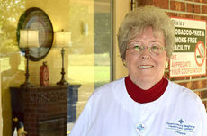 Volunteer Linda Garrett  makes 'fidget quilts' for hospice patients