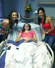 Everybody smile. Sydney, a Shriners patient and Lauren give big smiles for the camera.