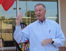 Allen Johnston reminds those attending the Bojangles' at Buncombe grand opening that a second restaurant is being built at Hwy. 101 across from Greer's BMW Manufacturing Co. Johnston and his wife, Lee Ann, are owner operators of Chix and Bix LLC, franchise owners of Bojangles'.
 