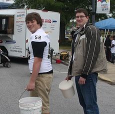 Garrett Poole, left,  and Roland Nall was the bucket brigade at Creation Station. They filled the buckets with water that was used in making paste and clay.