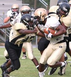 A Greer, right, and Gaffney player put their heads together to resolve this collision.
