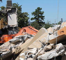 Demolition debris builds at the rear of Allen Bennett Hospital.
 