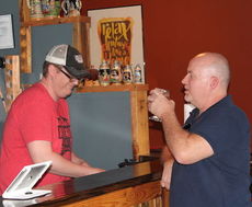 Andrew Reid, right, said he enjoys crafts beer the variety The Southern Growl offers.
 