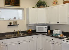 The kitchen has all the appliances and features plenty of cabinet space.
 
