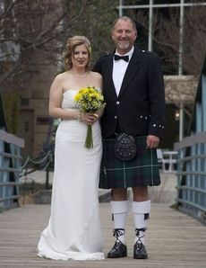 Lisa's wedding dress hung in the back of her closet for four years – not intended to be worn on her wedding day. Grey wore a traditional Scotland Highland kilt with a sporran and tuxedo jacket.