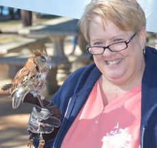 Wendy Watson holds Widget, a species of a screech owl.
 