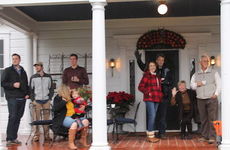 Parade watchers from the Perry and Erin Williams family home on Poinsett Street.
 
 