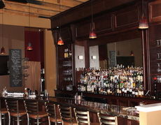 A fully stocked bar at The Strip Club 104 includes Jason Clark's own Flying Pig Barrel Aged Vanilla Bourbon.
 