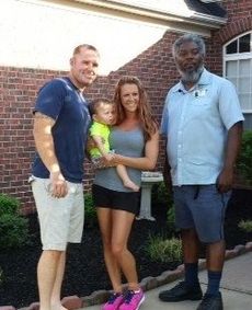 John and Stephanie Cooper with their son, Eli, and Greer letter carrier Chris Brown.
 
 