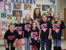 Children at Skyland Elementary School model the T-shirts designed and sold by Kehler Bryant, Miss El Dorado Teen 2014. They are Eli Hightower, Madison Mitchell, Kennedy Wallen, Abby Styles (who is also Little Miss Merry Christmas), Caroline Morris, Kloey McAbee, and Allonah Lambly.