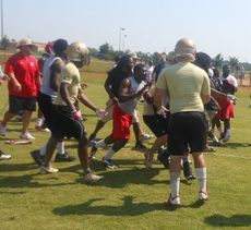 There were so many fights breaking out at Greer's scrimmage against Greenville today that bystanders and coaches from other teams can be seen in this photo trying to give aid to both teams' coaching staffs.