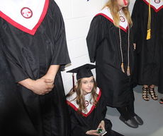 It was hurry up and wait before the ceremonies as grads lined the halls of Timmons Arena.
 