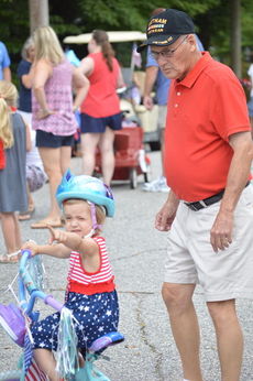 Joe Bullington, a Vietnam veteran, brought his granddaughter to the parade.
 