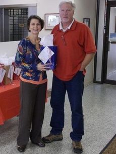 Ann Rainey presents a gift bag to David R. Taylor, U.S. Army veteran and bank customer, at the N. Main Street Greer branch. 
 
 