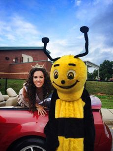 Anna Brown, a graduate of Greer High School, recognizes a friendly mascot at Friday's Crestview Elementary School Book Float Parade.
 