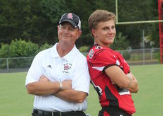 Jake Smith will start at quarterback for Blue Ridge. Coach Steve Euote posted for this picture on photo day.
 