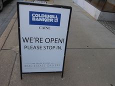 The sign says it all at the Coldwell Banker Caine gallery at 104 Trade Street.