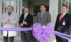 Getting in position for the ceremonial ribbon cutting are, Bishop Guglielmone, Mark Nantz, Dr. Alex Xuezhong Yang, oncologist, and Dr. Stephen Dyar, Upstate Oncology Associates.
 