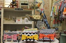 The chevron pattern on these purses is a contemporary design that is in favor with consumers this year.