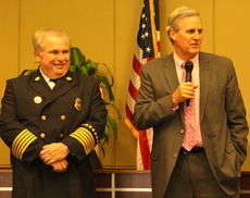 Mayor Rick Danner honors retiring Fire Chief Chris Harvey with the key to the city and other gifts for his 38-years of service.
 