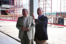 Hank Ramella, GSP commissioner, and Dave Edwards, right, Executive Director of the GSP Airport District, observe the construction ongoing as part of the airport's $122 million terminal improvement plan.