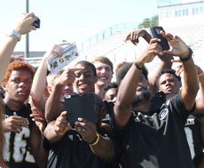 Greer coaches Erie Williams, left, and Mazzie Drummond take selfies as players get enjoy getting in on the action.
 
 