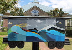 Greer Middle College Charter High School is represented on the boxcar in front Citizens Building & Loan on Trade Street.
 
 
 