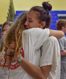 Sofia Giordani gets hugged after the viewing of the video explaining FOXG1.
 
 
 