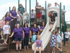Principal Jane R. Mills, on the slide, members of the Chandler Creek Elementary PTA and their children got a sneak peak of the new playground equipment for first and second graders and the after school program. PTA members wearing purple shirts are Lisa Hackney, Amy Judd, Kasey Driscoll, Shawna Schneider, Jennifer Gutchess (2014-2015 PTA president) and Marie Paris (president 2013-2014).
 
 
 
 