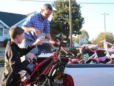 A pickup truck full of bikes are off to storage until the toys are distributed next month.
 