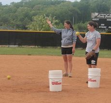 Greer coach Ashleigh Anderson, right, instructed her players during bunting practice.
 