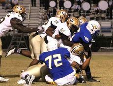 There's a lot of Greer tacklers wanting to take down this Eastside ballcarrier. Greer's defense held Eastside to  minus 57 yards net rushing.