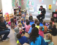 Officer John Saunders of the Greer Police Department had all the children's attention.
 
 