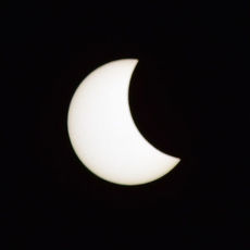 The moon is shown passing right to left over the sun as the eclipse begins.
 
 