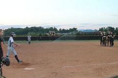 The sprinklers came on causing a brief delay .
 