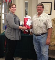 Christen Langford presents Eddie Griffin with a gift bag at the Poinsett Street branch.
 
 
 
 