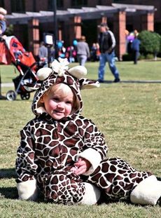 Heath rests in his giraffe costume during Saturday’s Halloween Hoopla co-sponsored by Freedom Fellowship Church and City of Greer.