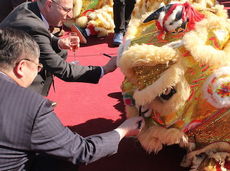 Robert Cao, Jiangnan Mold Plastic Technology Corp. General Manager, paints eyes on a dragon during the groundbreaking ceremony.
 