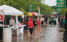 Food vendors break down their stations after Family Fest officials canceled the evening's activities because of steady rain with cold temperatures.