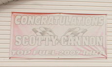 Scotty Cannon's 2007 IHRA Championship sign is weathered hanging on the side of Cannon's Restaurant.
 